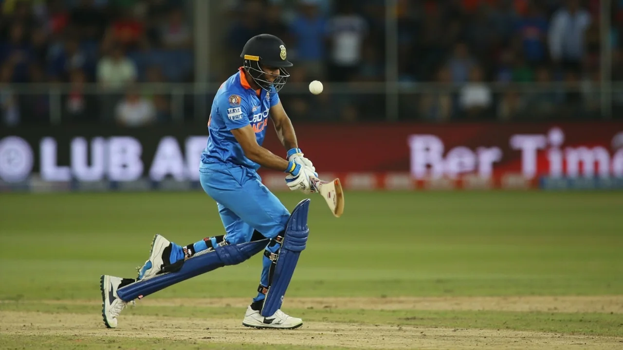 An India batter plays a high-elbow drive through the off side during the third T20I in Harare